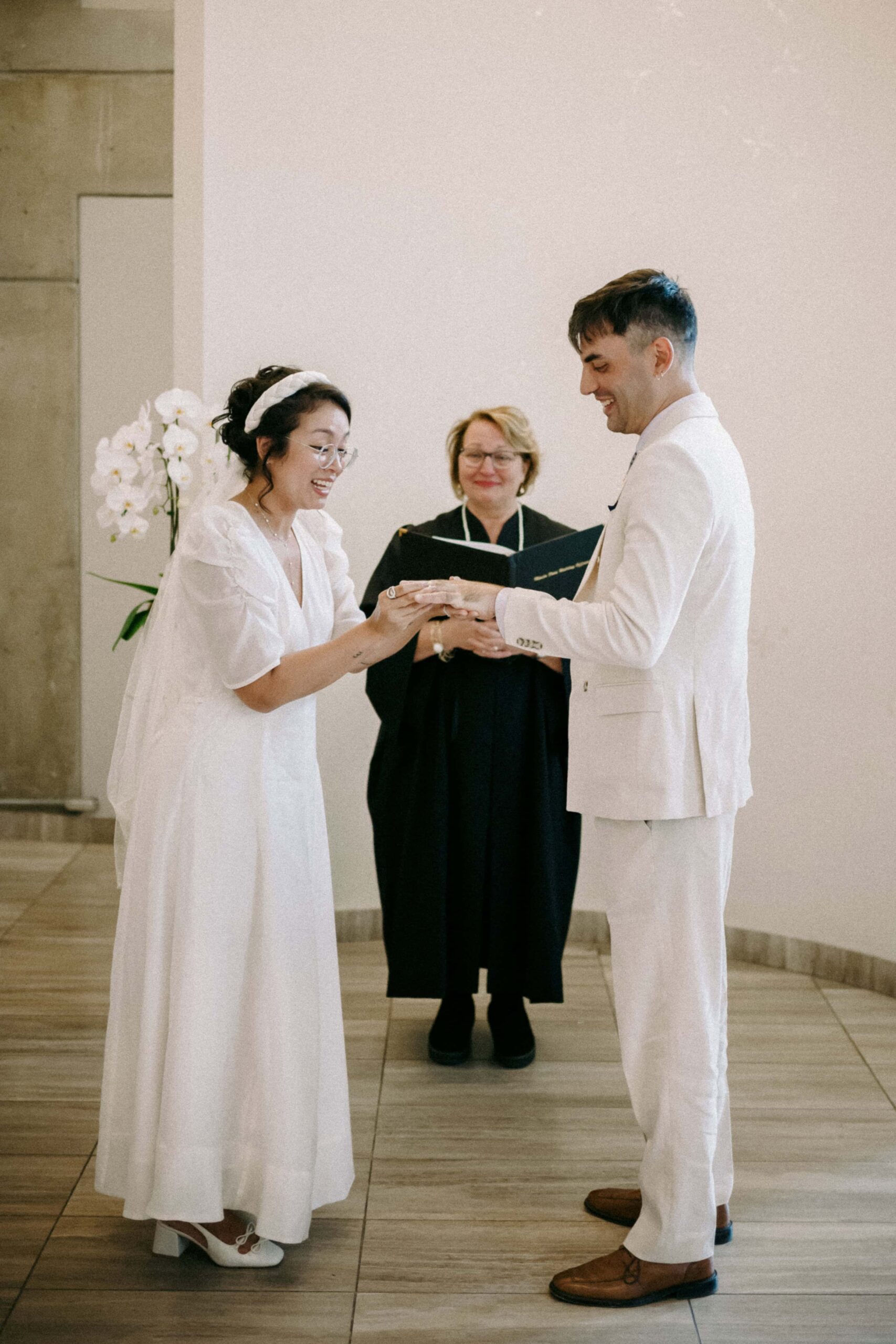 Toronto City Hall wedding couple exchanging rings